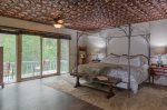Master bedroom with full size bathroom & private porch
